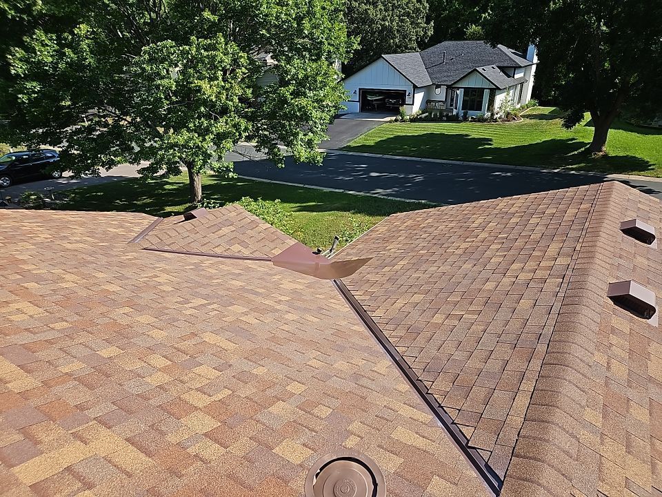 the roof of a building with a chimney on top of it .