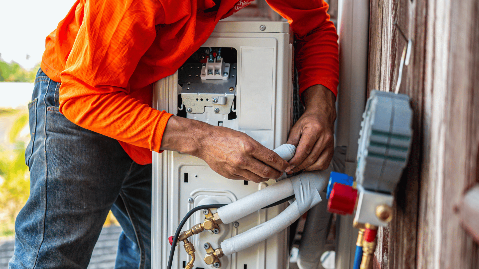 HVAC tech with toolbag