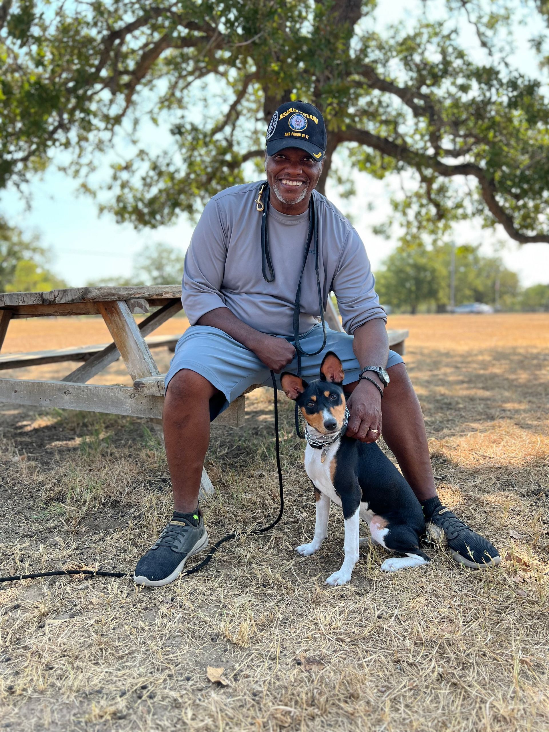 Owner and dog in the field with certificate - Bastrop, TX - K9 Mastery