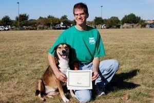 Owner and dog in the field with certificate - Bastrop, TX - K9 Mastery