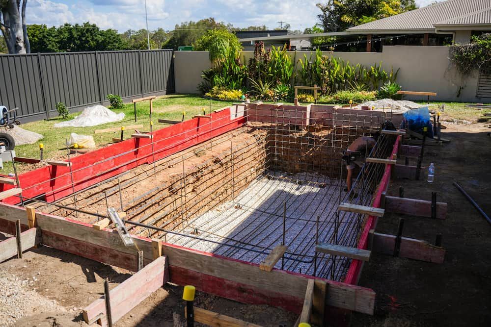 Black Metal Gate Open to a Pool Area — Concrete Pool Projects in Seventeen Seventy, QLD