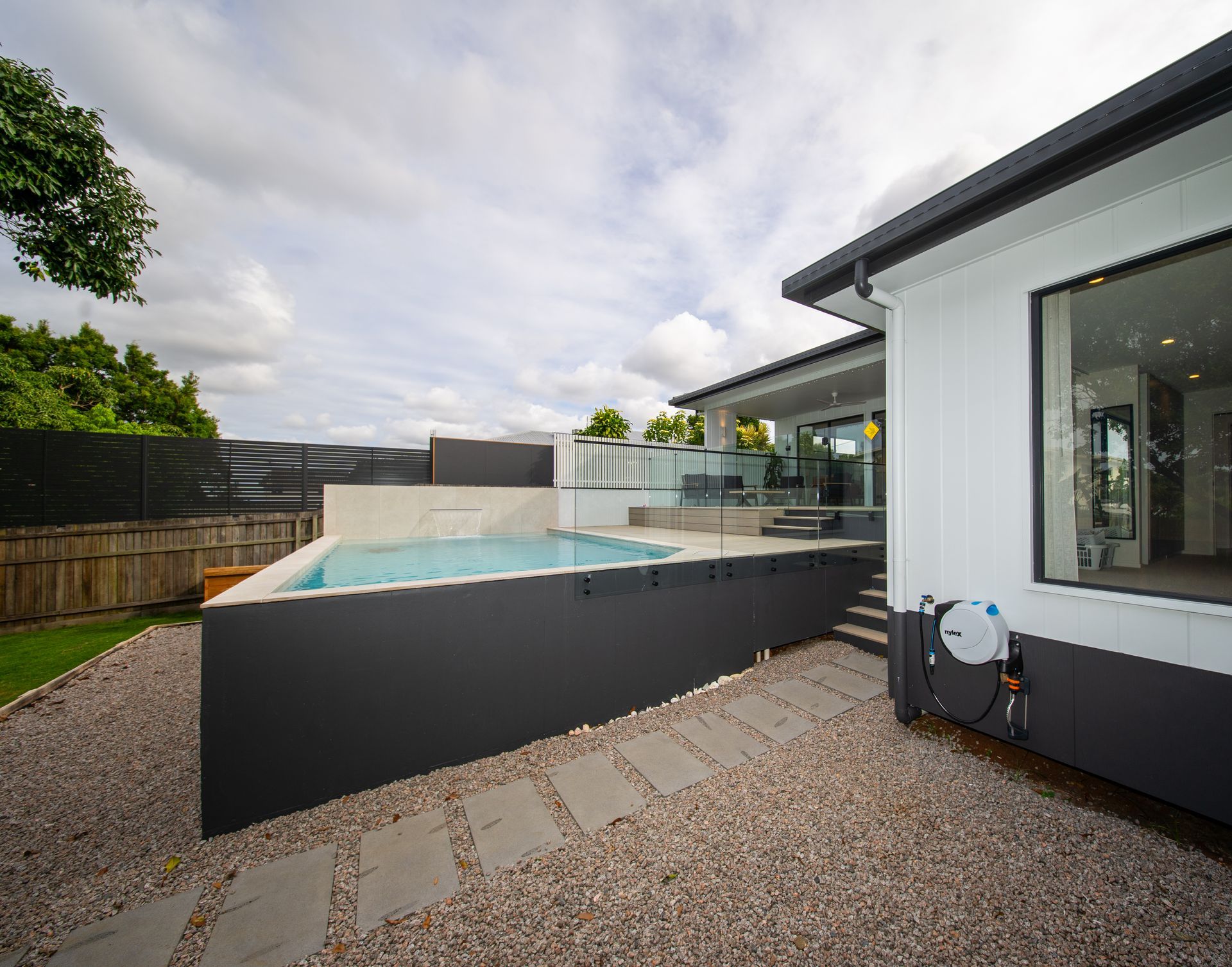 Rectangular Outdoor Swimming Pool With Blue Water — Concrete Pool Projects in Calliope, QLD