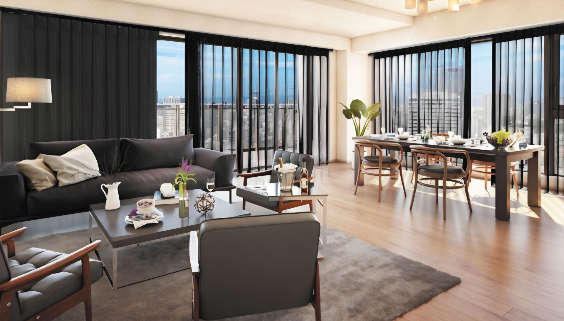 Modern living room with dark gray sofa, dining table, and large windows with black blinds.