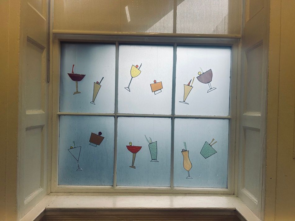 Cocktails in the Sky, a series of cut stained-glass and mirror works by Kelly Ratchford,  part of the Olivier Cornet Gallery's 2025 Bloomsday / Summer group exhibition Out of Lines