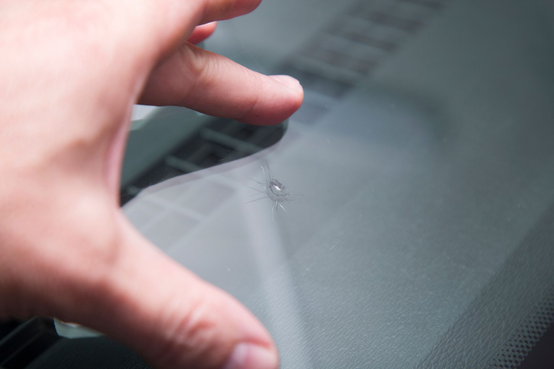 A small crack on a windscreen.