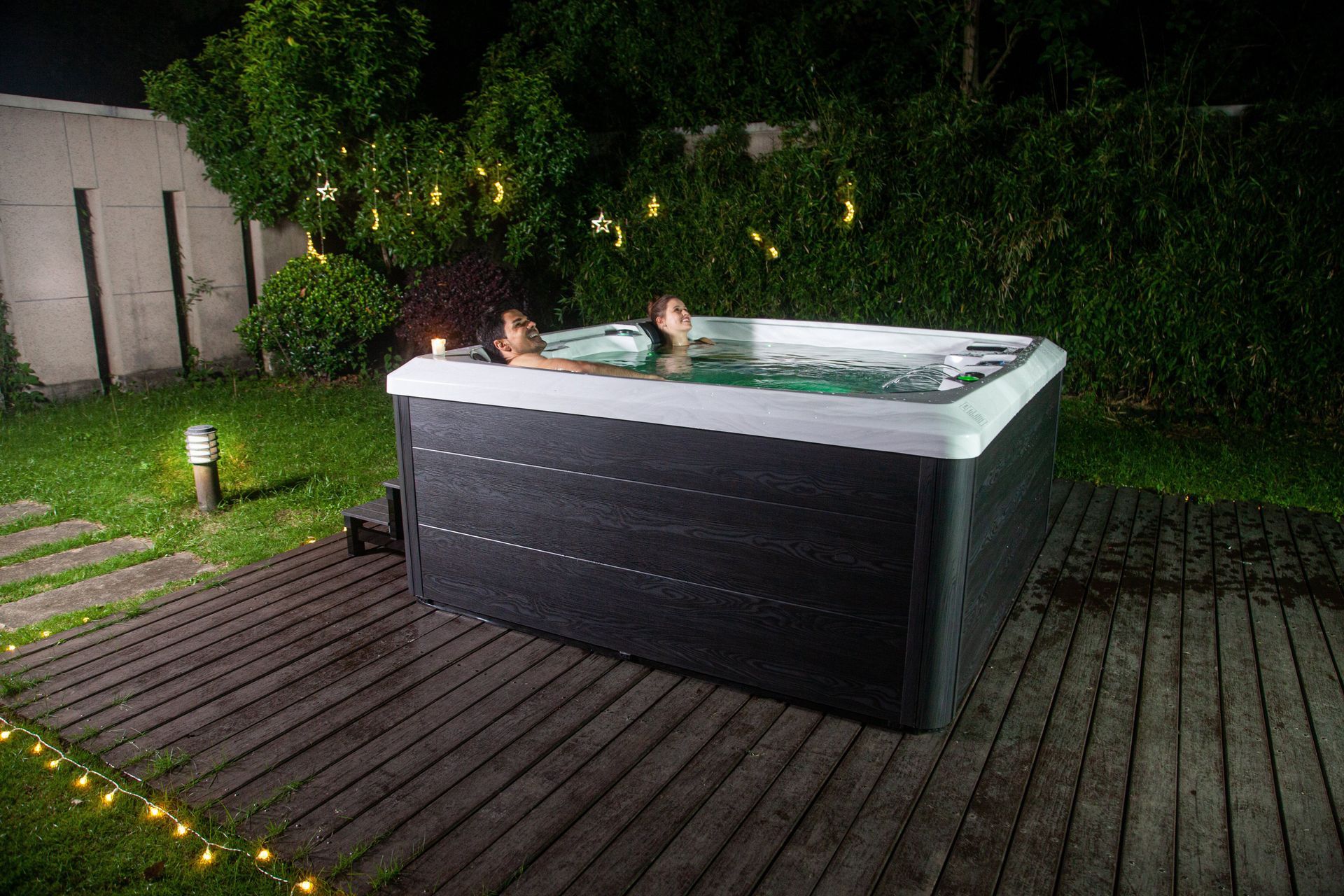 Pacific Spa hot tub being enjoyed by a couple