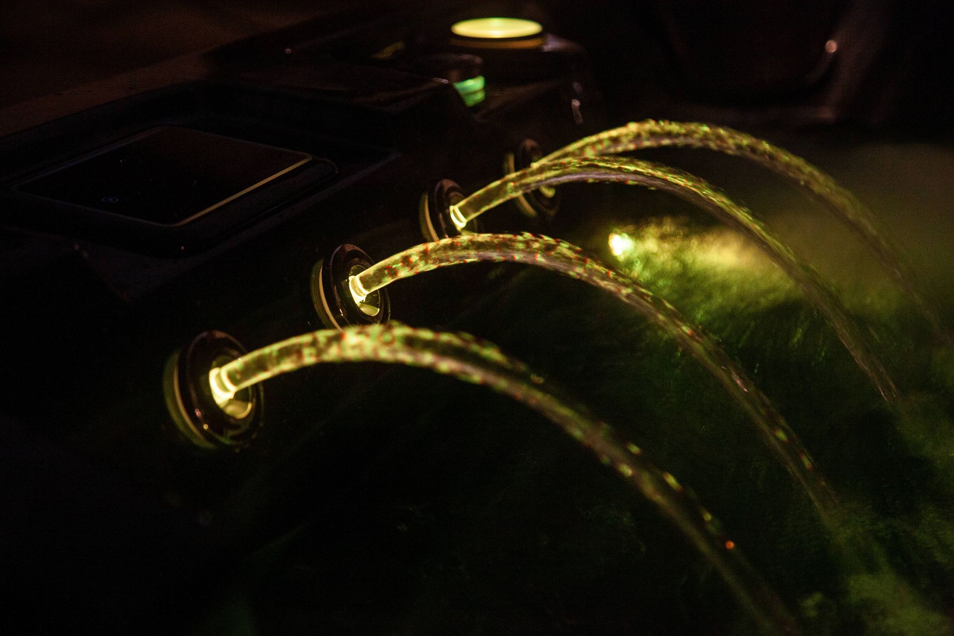 Pacific Spa hot tub waterfall feature with yellow lights