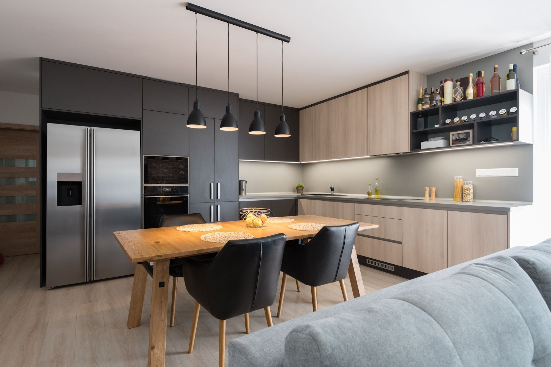 A kitchen with a table and chairs in it