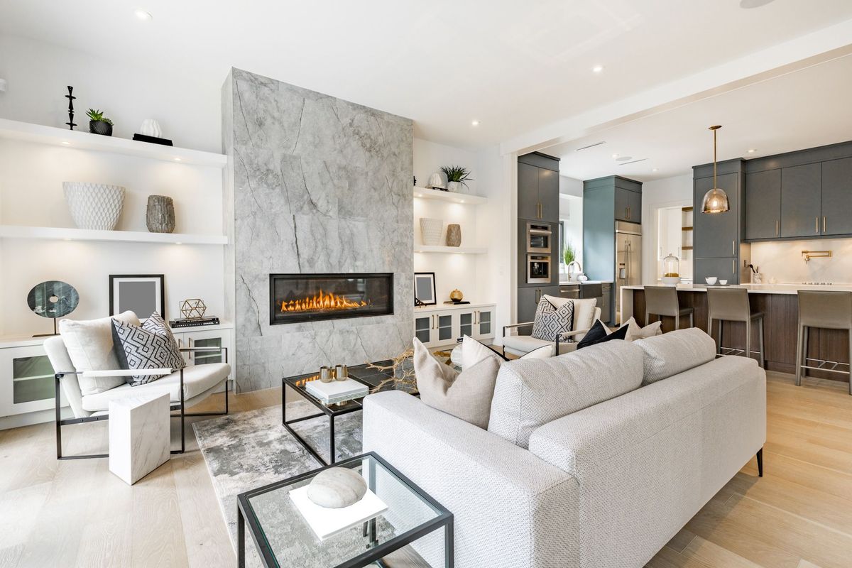 A living room filled with furniture and a fireplace.