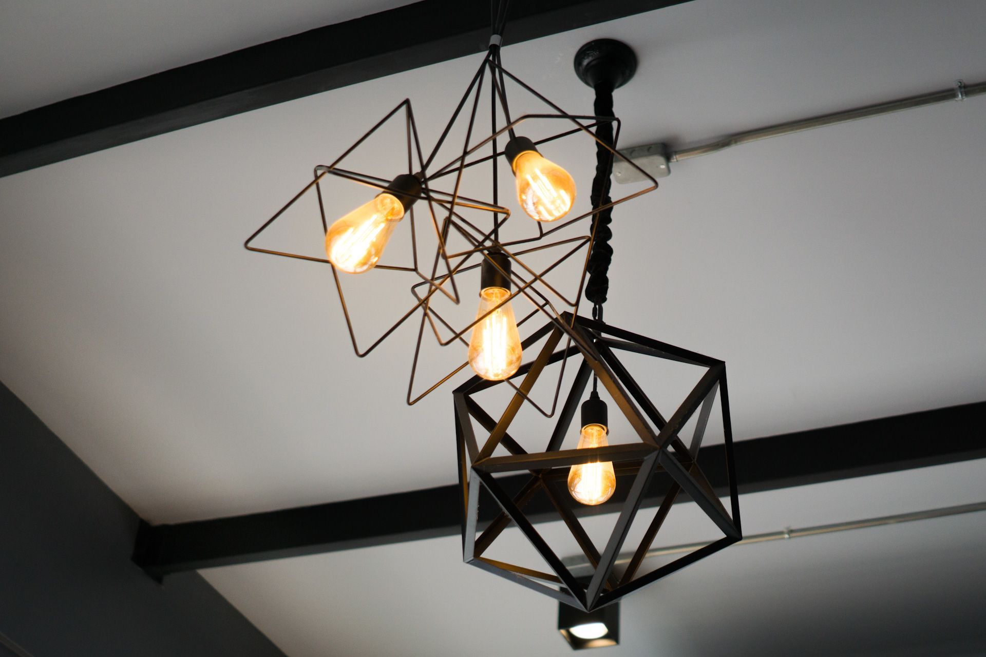 A close up of a light fixture hanging from the ceiling