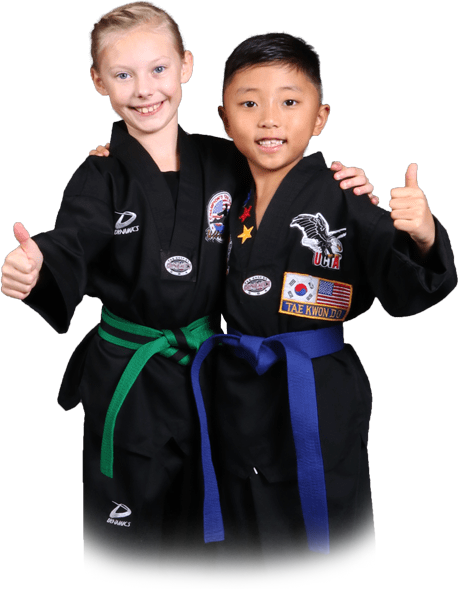 a group of children are practicing martial arts together .