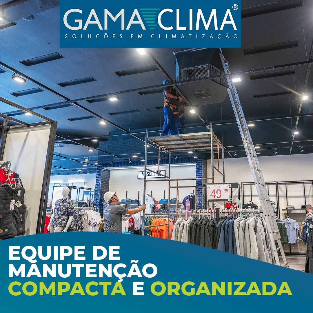 Um grande ar condicionado está no topo de um telhado.