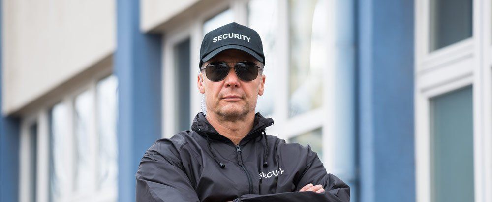 security guard standing by building