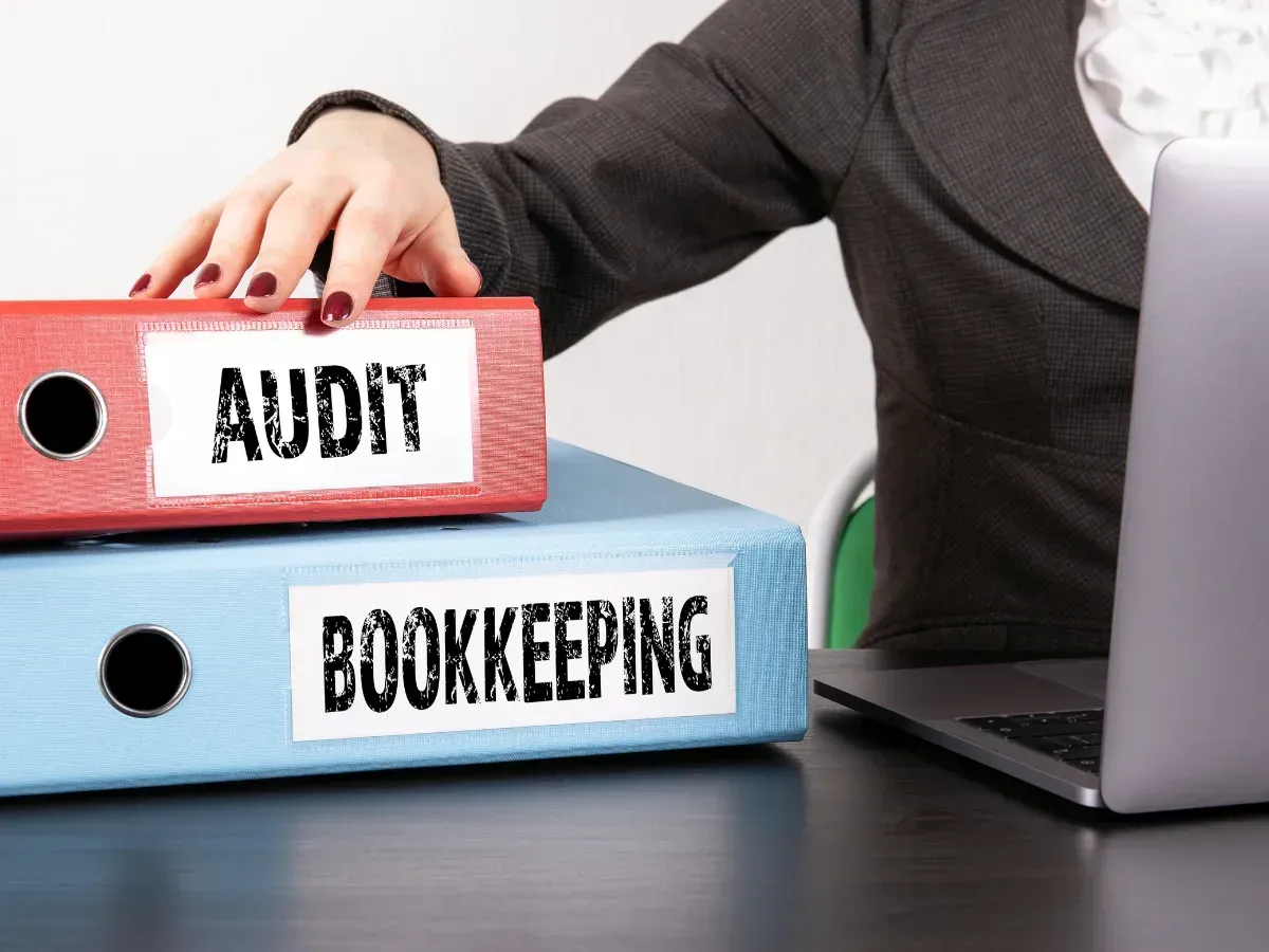 a woman checking audit and bookkeeping records