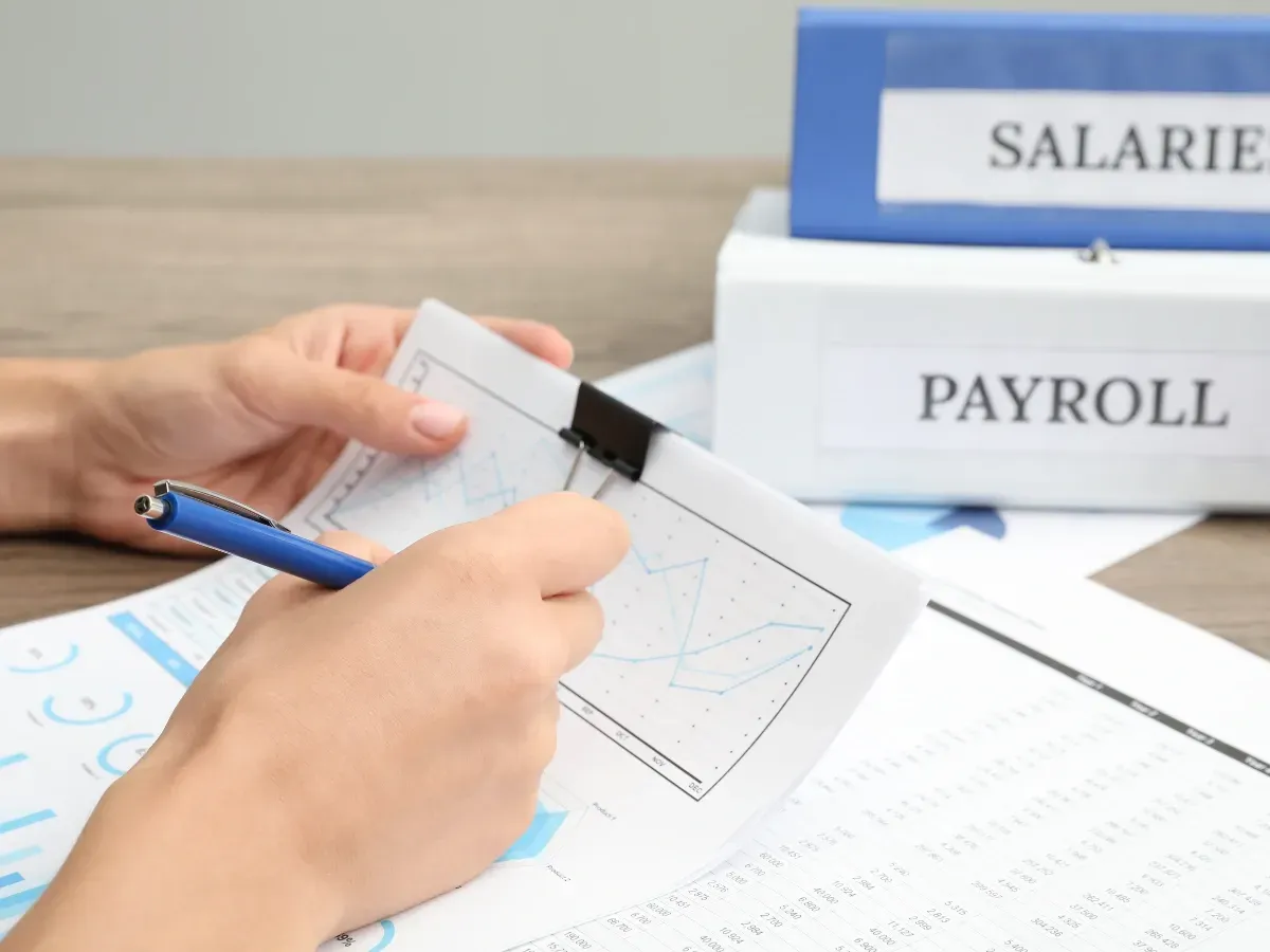 an outsourced expert managing payroll