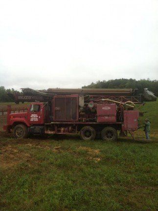 well drilling truck in field - McArthur, OH