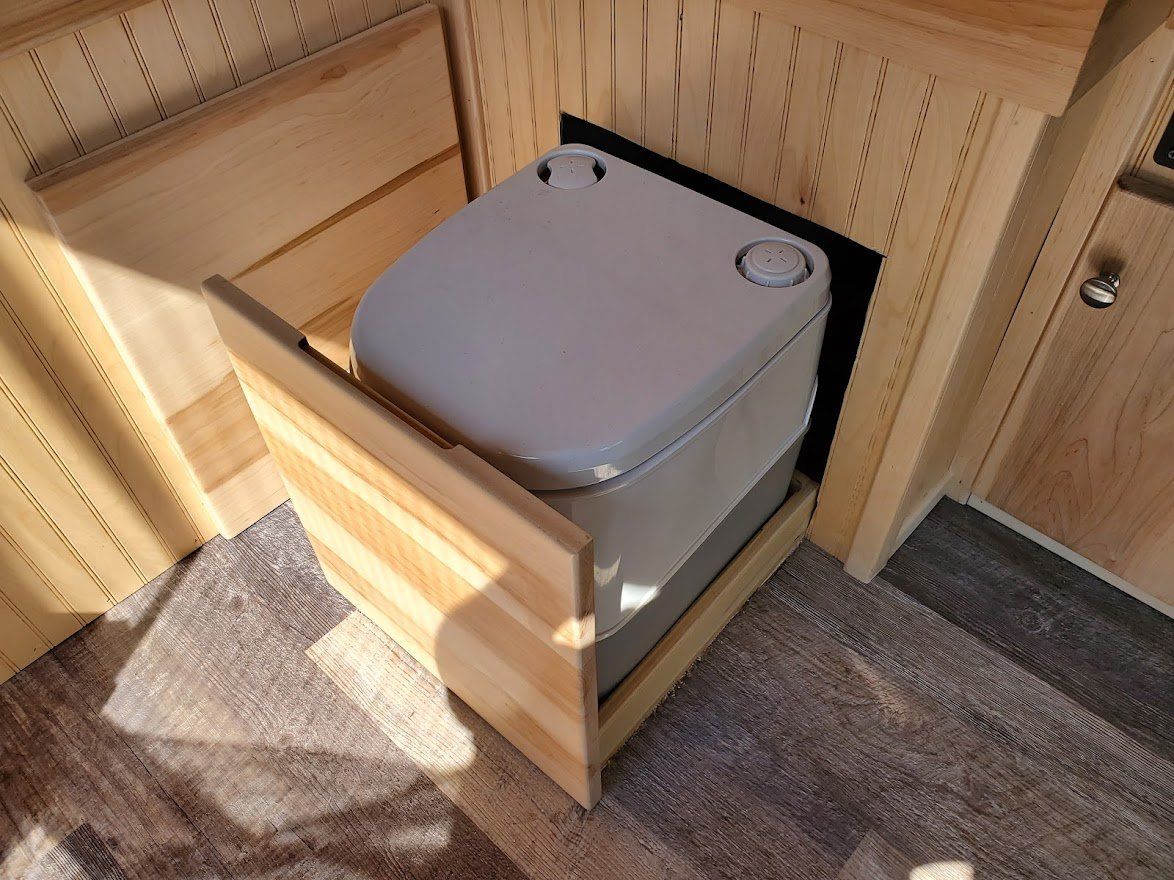 Grey Toilet Inside The Camper Van - Milton, NH - RV Service and R & L Van Builds