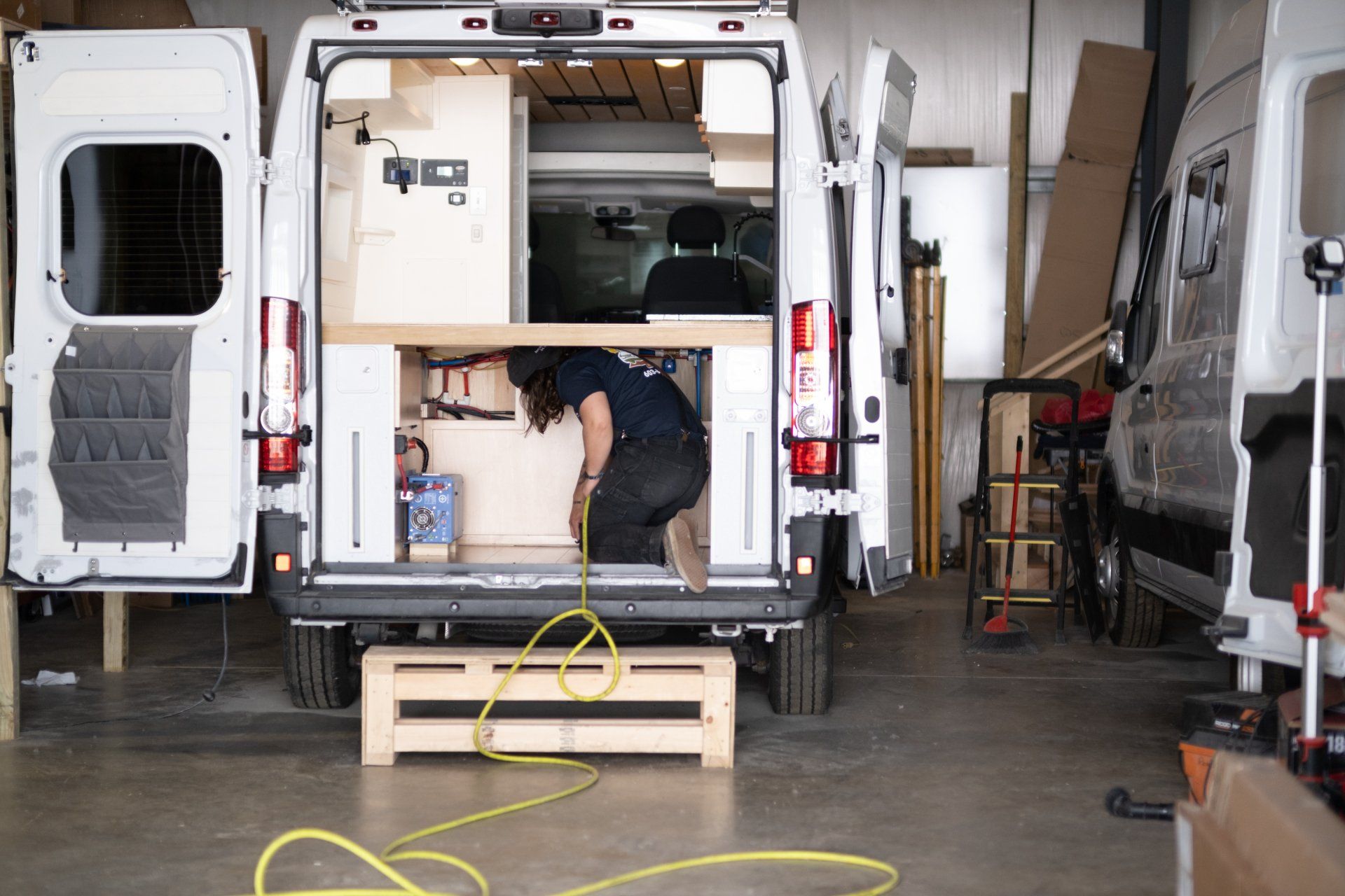 Staff Fixing The Back Of Camper Van - Milton, NH  - RV Service and R & L Van Builds