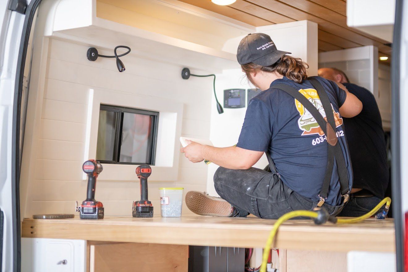 Staff Fixing The Camper Van While Sitting  - Milton, NH  - RV Service and R & L Van Builds