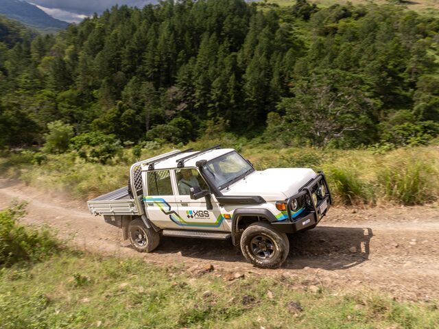 White Pickup Truck Driving on A Dirt Road — Lacey's TJM 4X4 Megastore in Rockhampton City, QLD