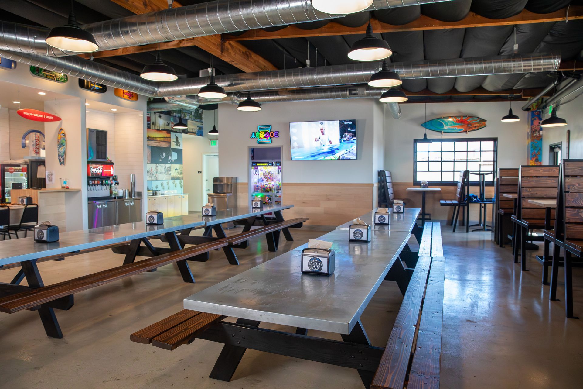 There are a lot of tables and benches in this restaurant.