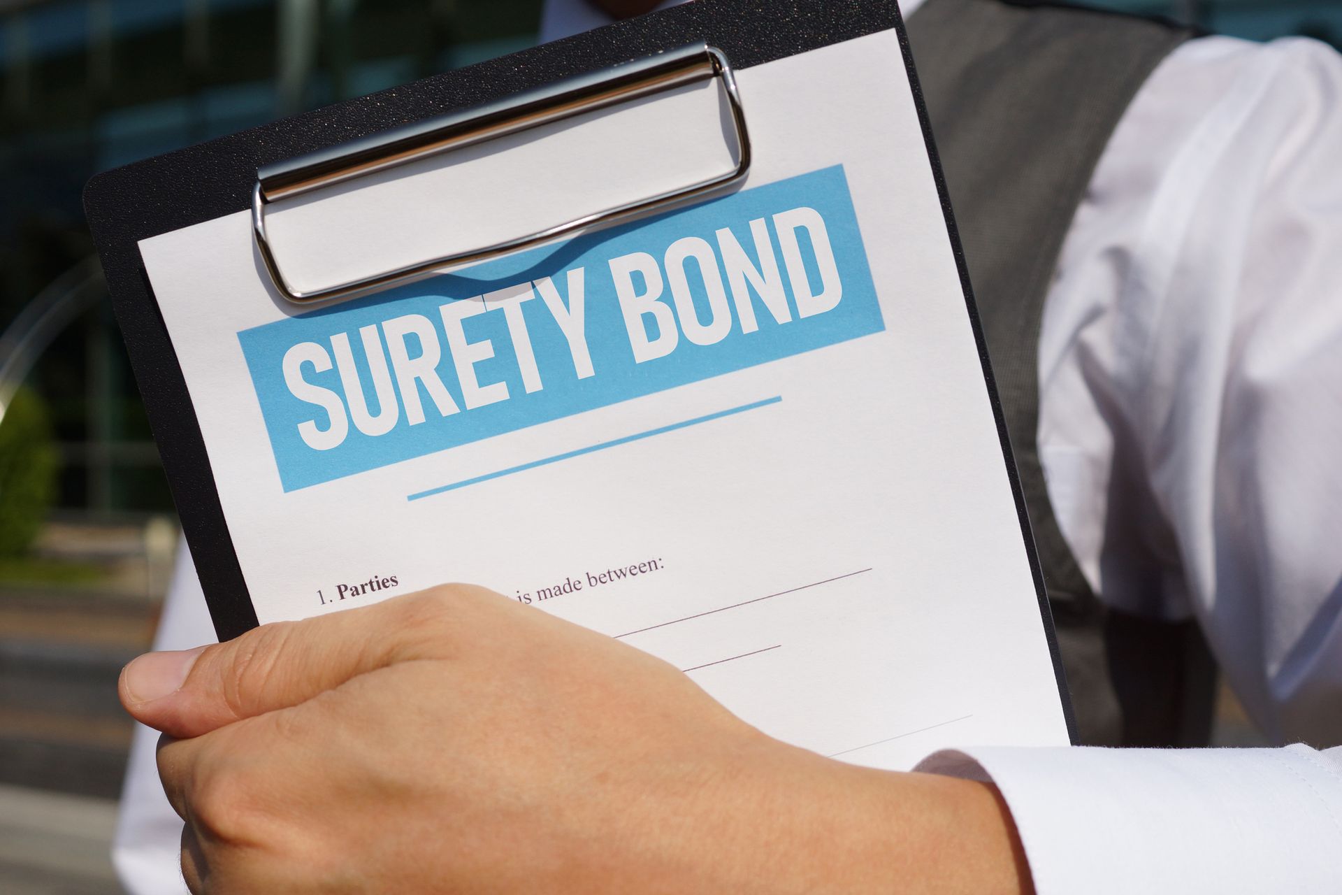 The word bond is written on wooden blocks next to a roll of money.
