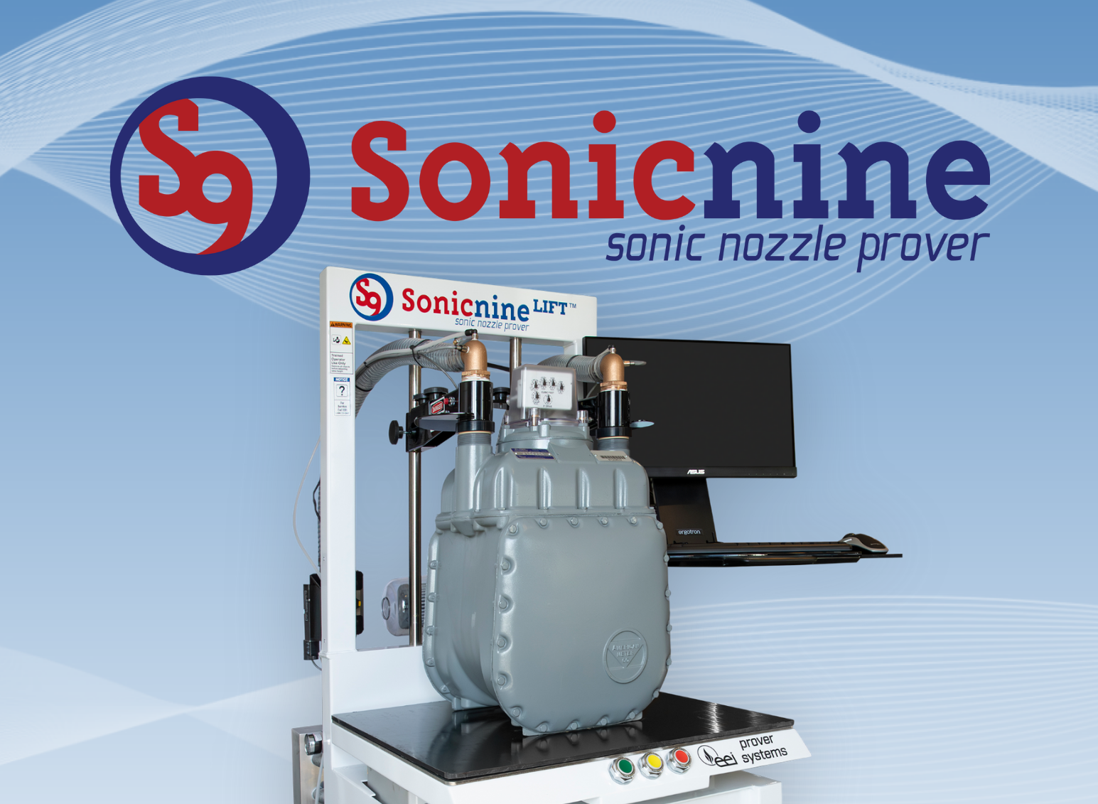 Sonicnine sonic nozzle prover machine with logo on a blue background. The machine is gray, and a computer monitor is attached.