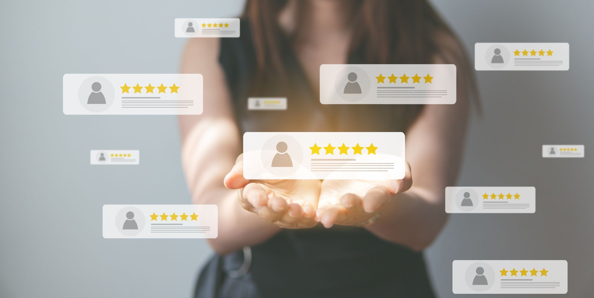 Woman holding floating review icons, emphasizing customer feedback and ratings.