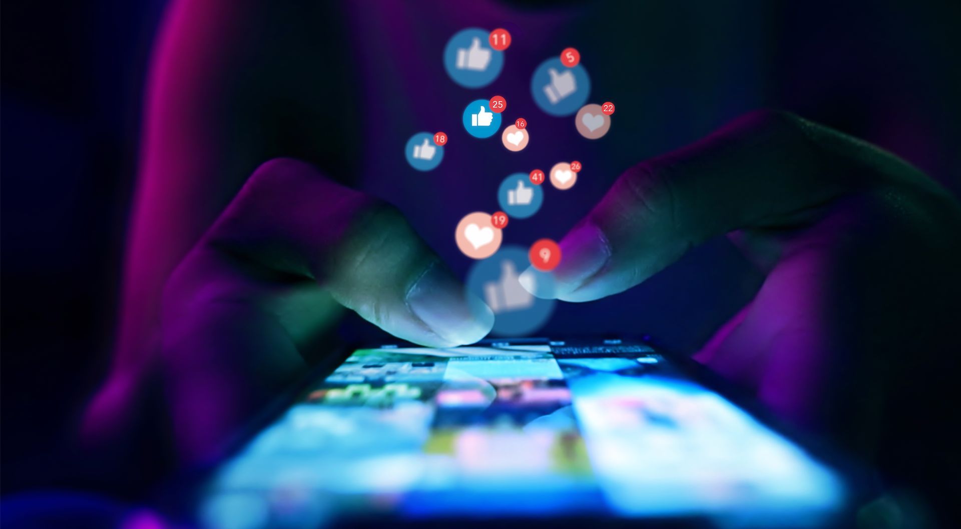 Hands using a smartphone with glowing thumbs-up icons floating above; purple and blue light.