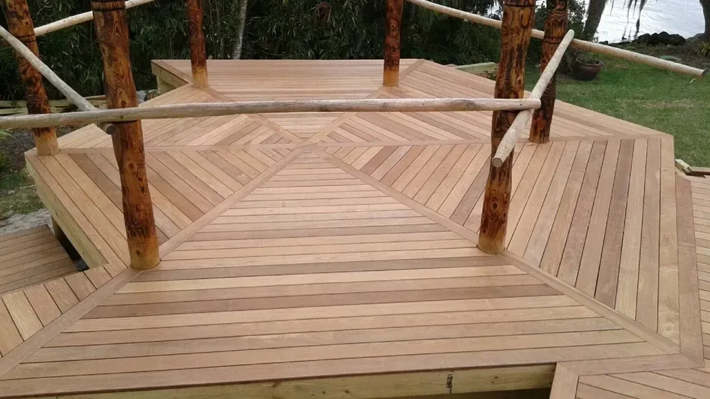 A wooden deck with stairs leading up to it