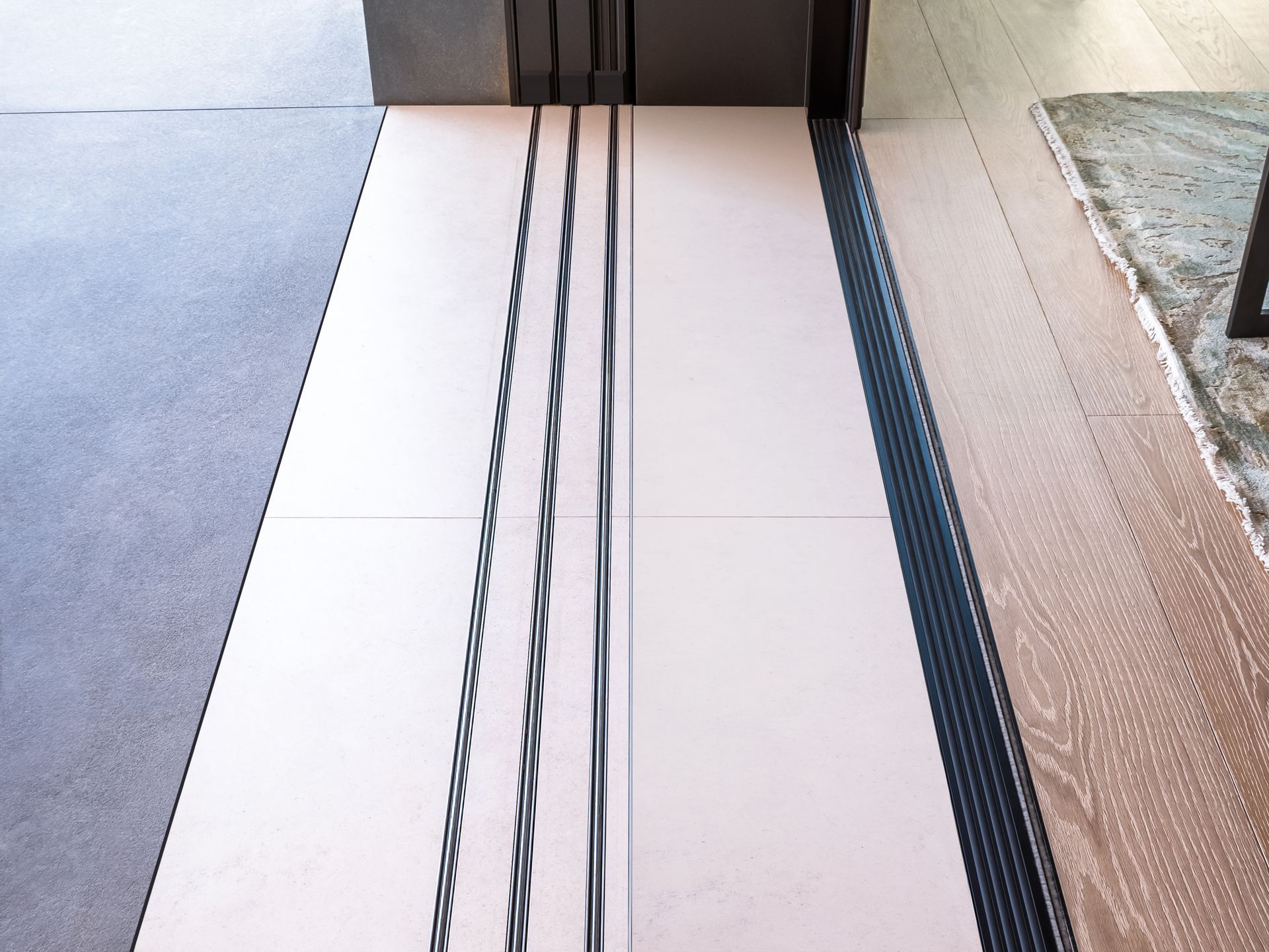 A white tile floor with black lines on it