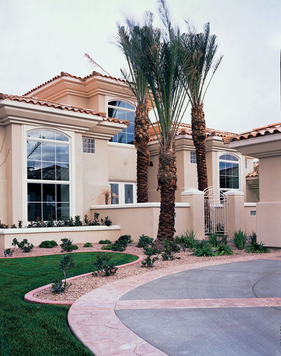 A large house with palm trees in front of it