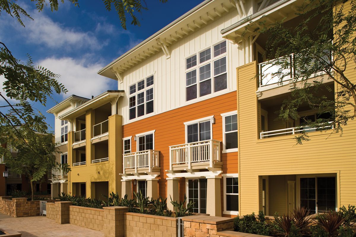 A large apartment building with a lot of windows and balconies
