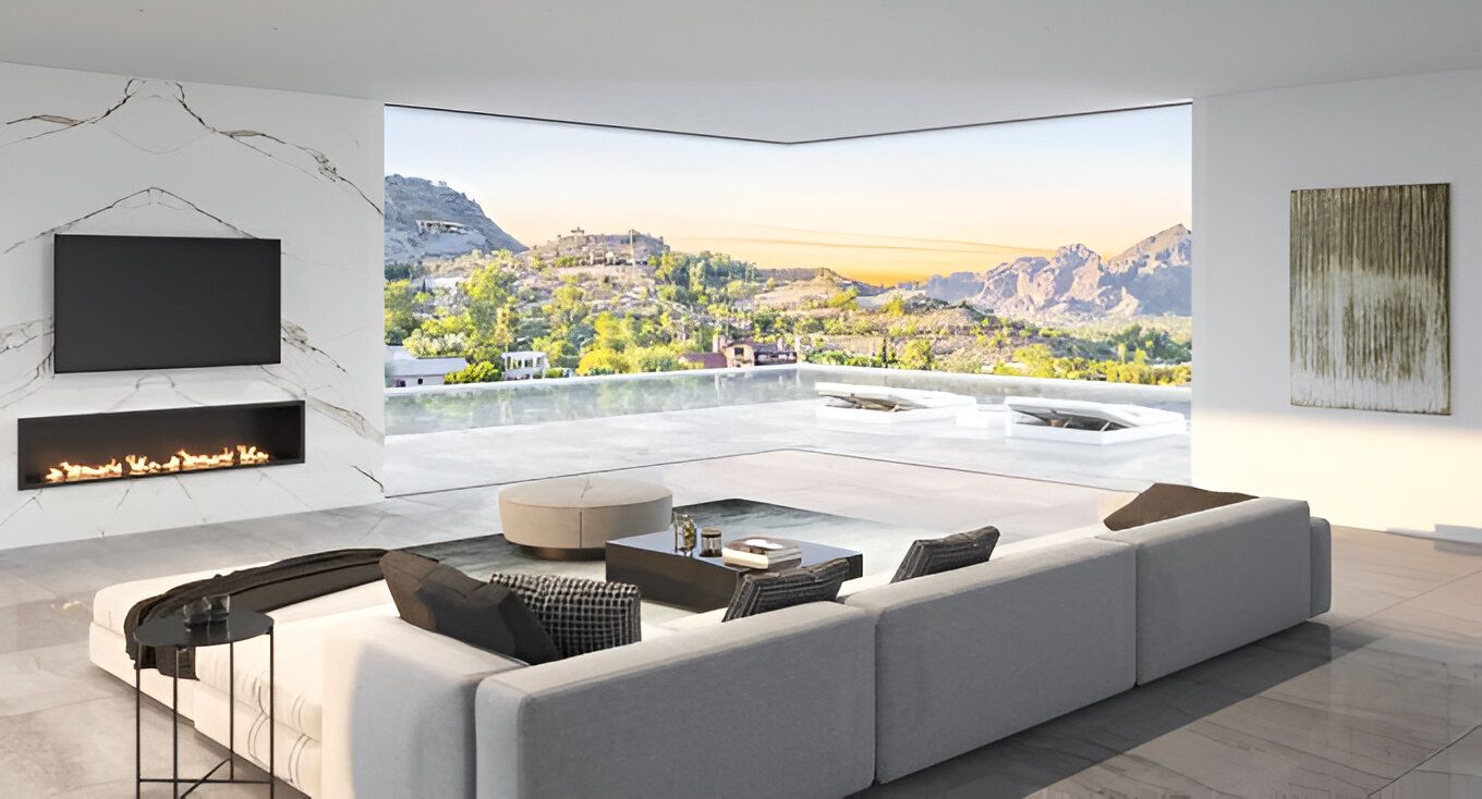 A living room with a couch , fireplace and television.