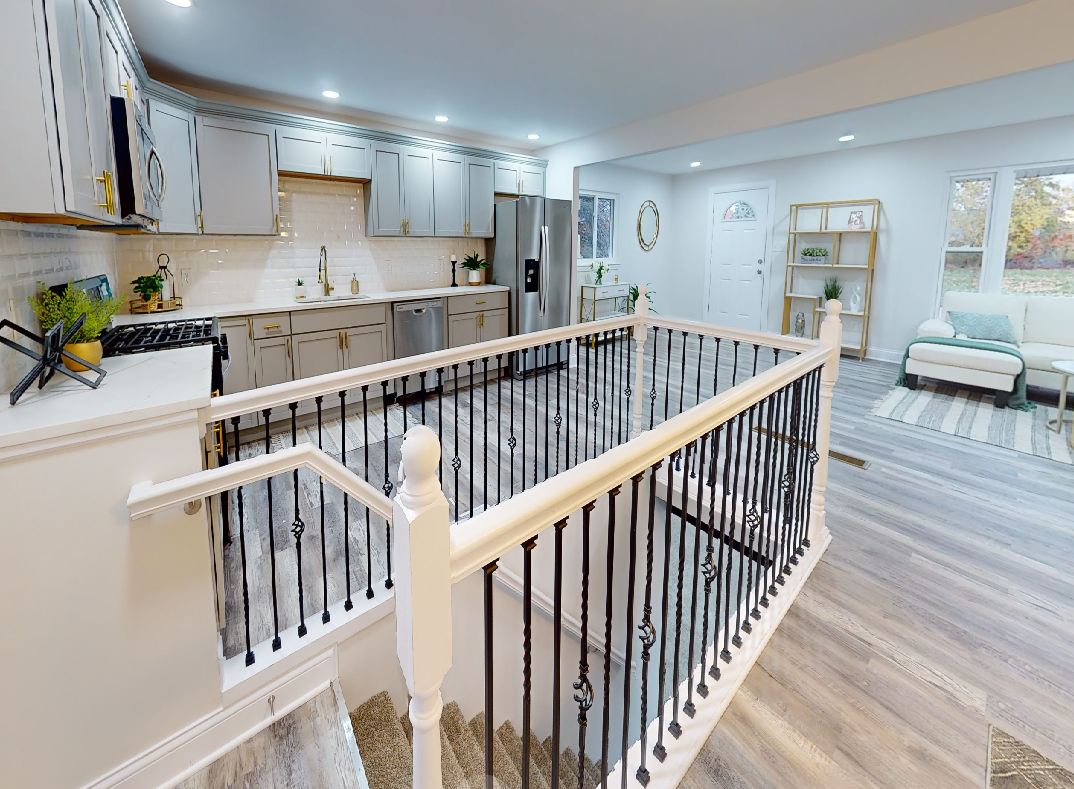 There is a staircase leading up to the second floor of a house.