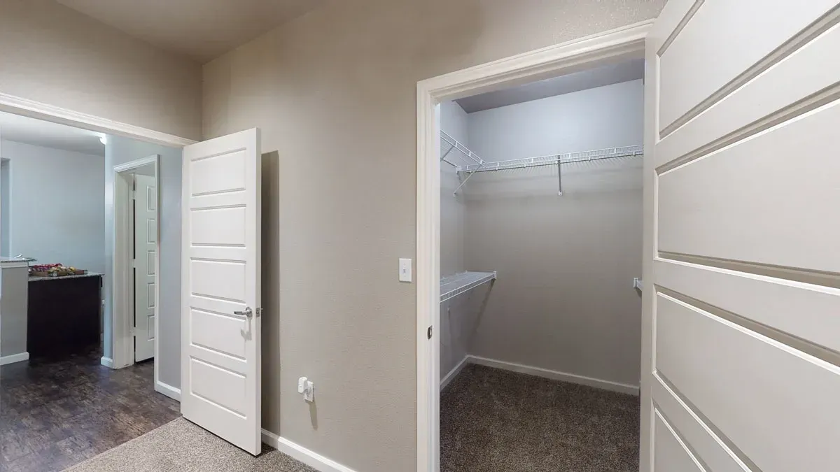 There is a walk in closet in the middle of the room.