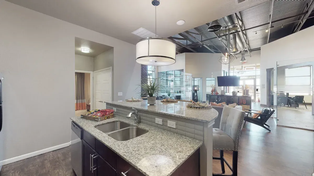 A 3d model of a kitchen with granite counter tops and a sink.