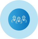 A group of people wearing hard hats in a blue circle.