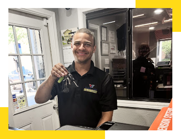 Our Expert Staff at holding car keys in Plano, TX | Plano Lube & Auto Repair
