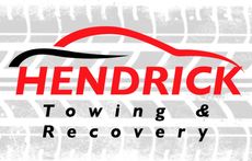 Hendrick Towing & Recovery logo with a red car outline and white text on a black background.