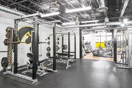 Modern indoor basketball court with hardwood floors and high ceilings at Hawks Ridge