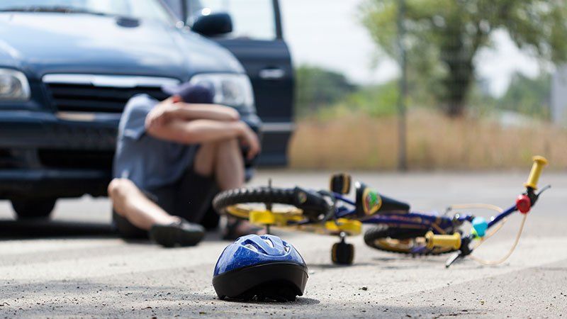 Boy upset with bike on ground