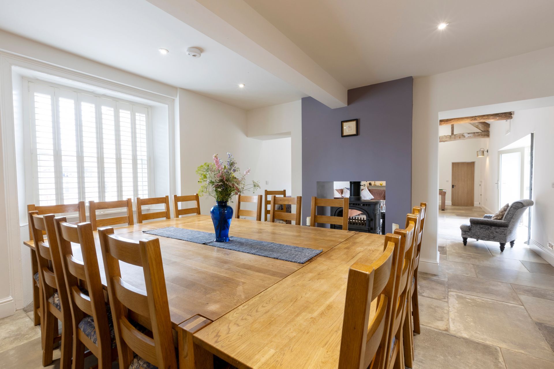 A bedroom with a king size bed and a picture on the wall above it.