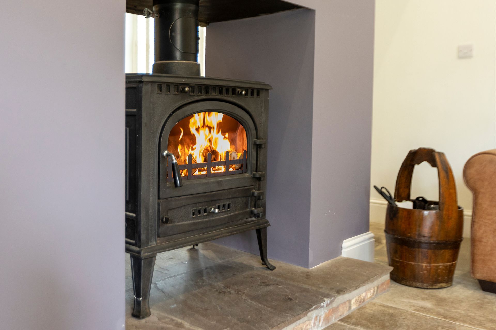 A dining room table with a vase of flowers on it.