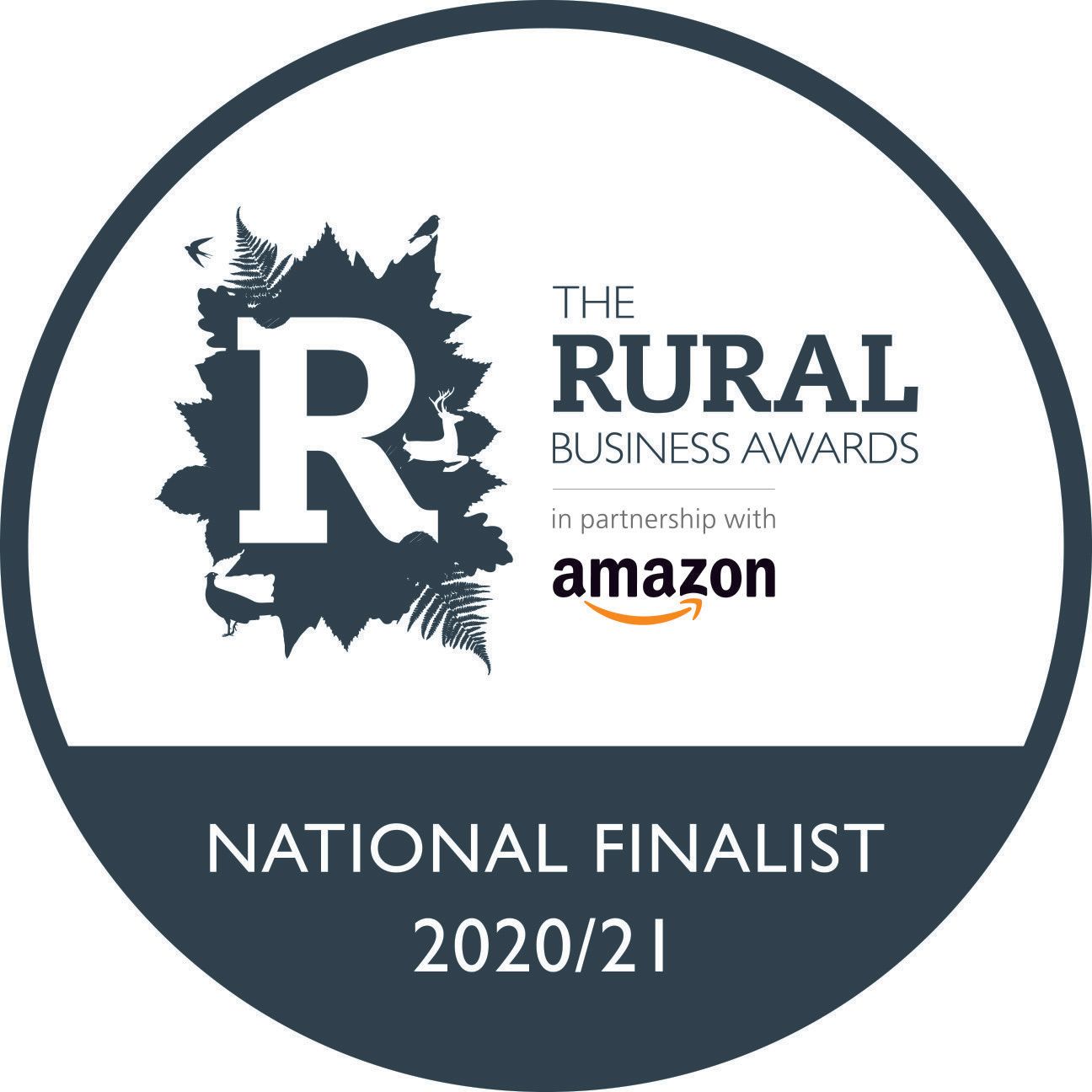 A logo for the rural business awards in partnership with amazon