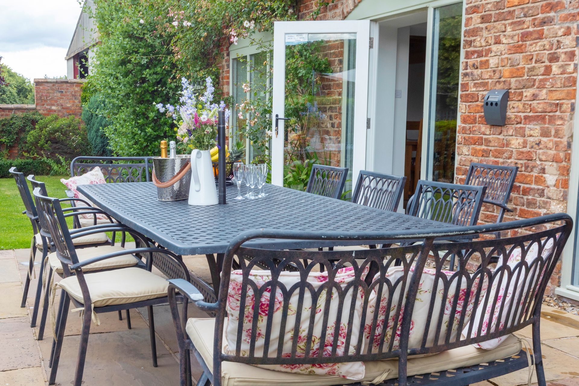 A dining room with a long wooden table and chairs