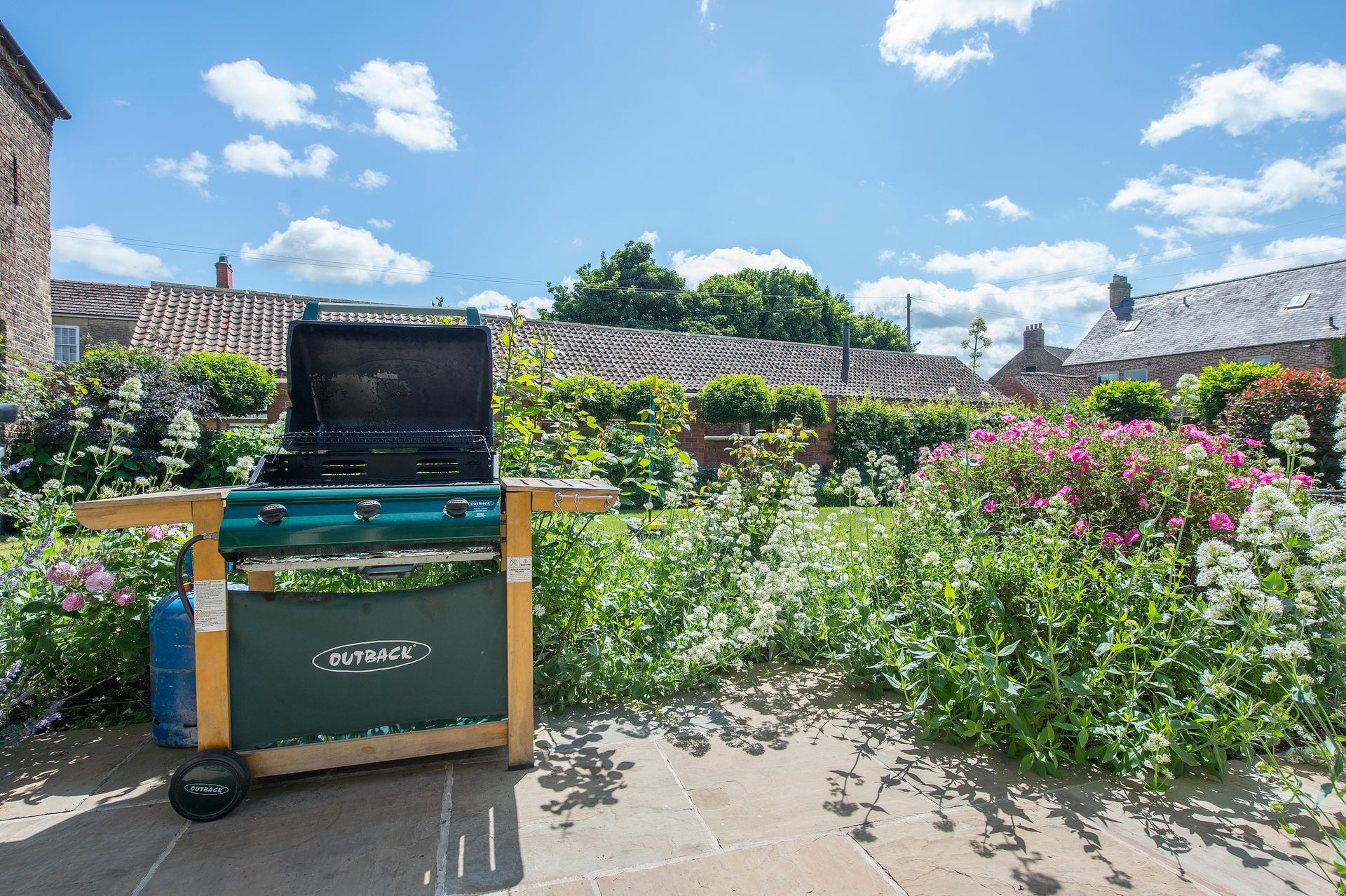 A living room with a couch a chair and a fireplace