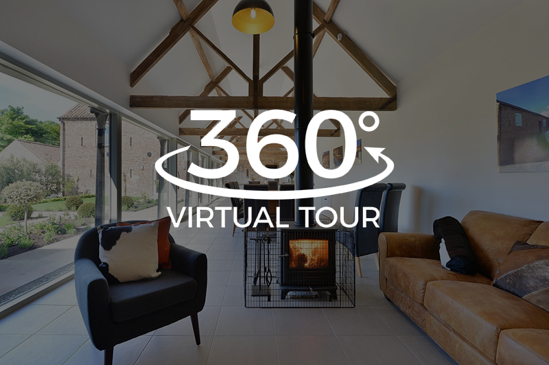 A 360 degree virtual tour of a living room with a fireplace.
