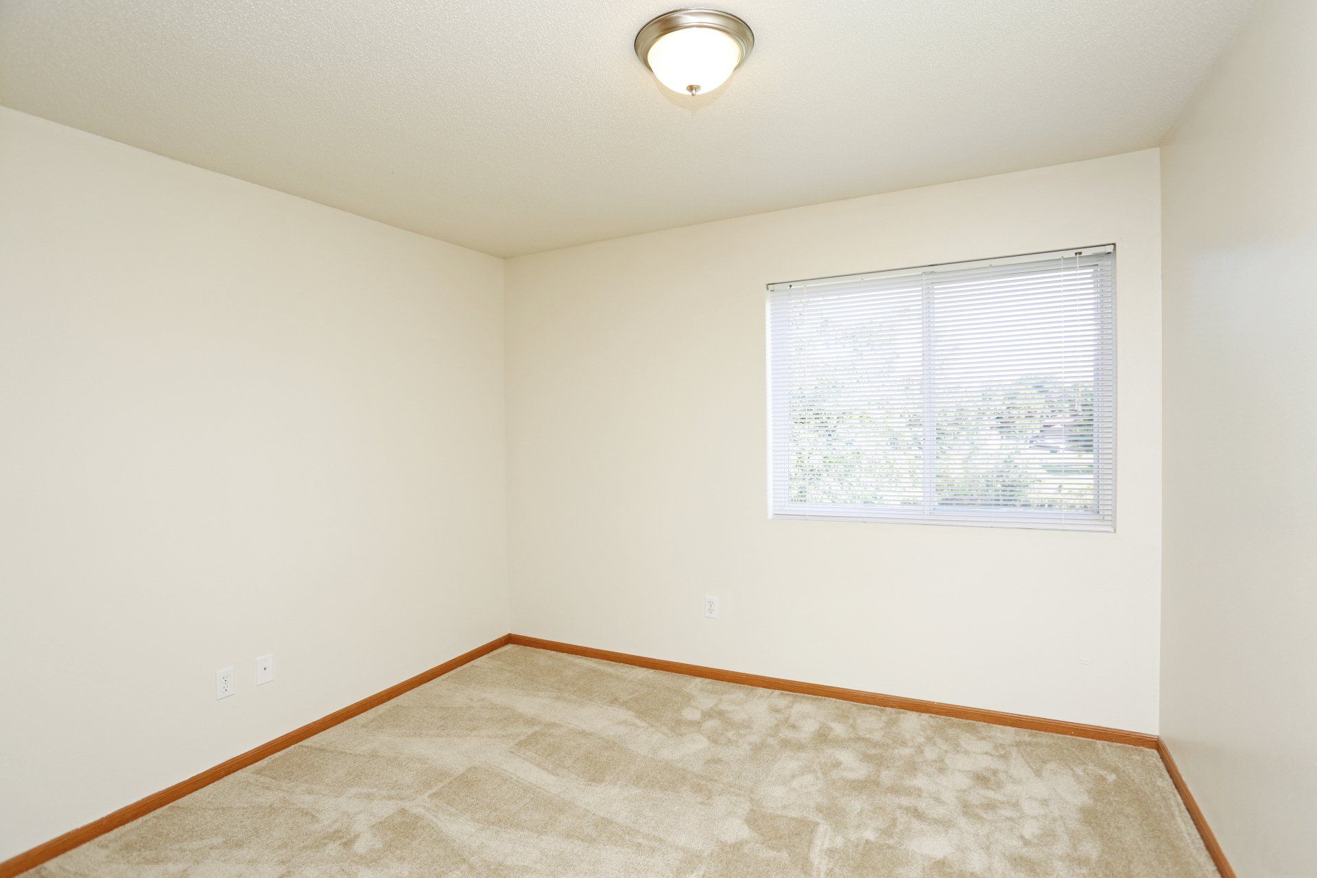 Bedroom with large window on wall