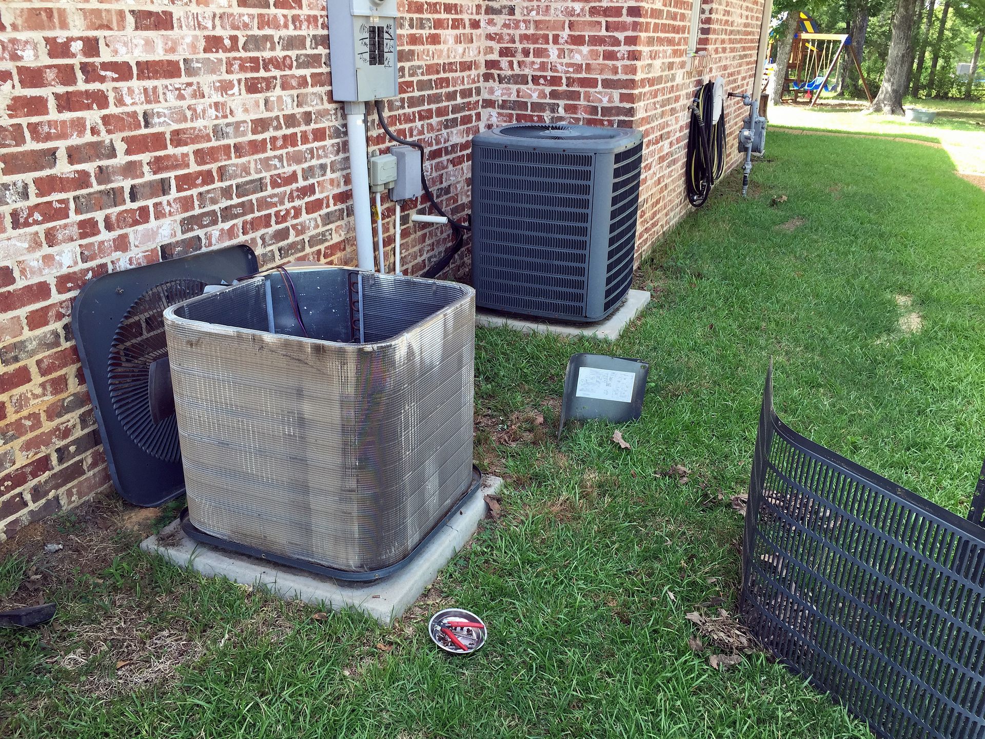 Air conditioner maintenance, cleaning condenser coils.